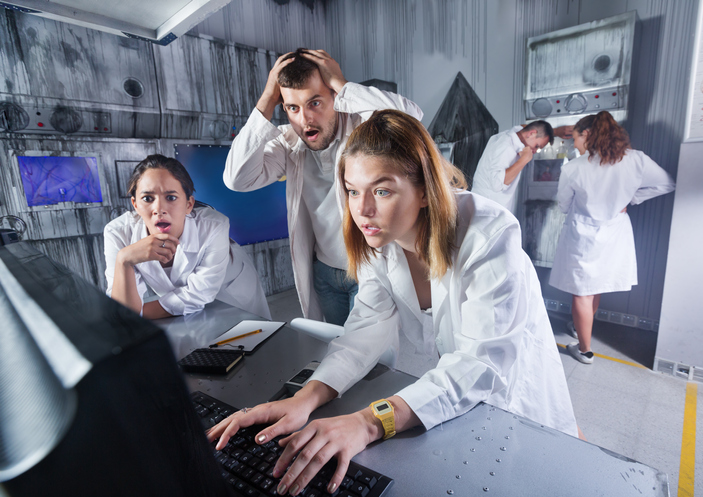 Group of adults trying to get out of an escape room stylized under laboratory